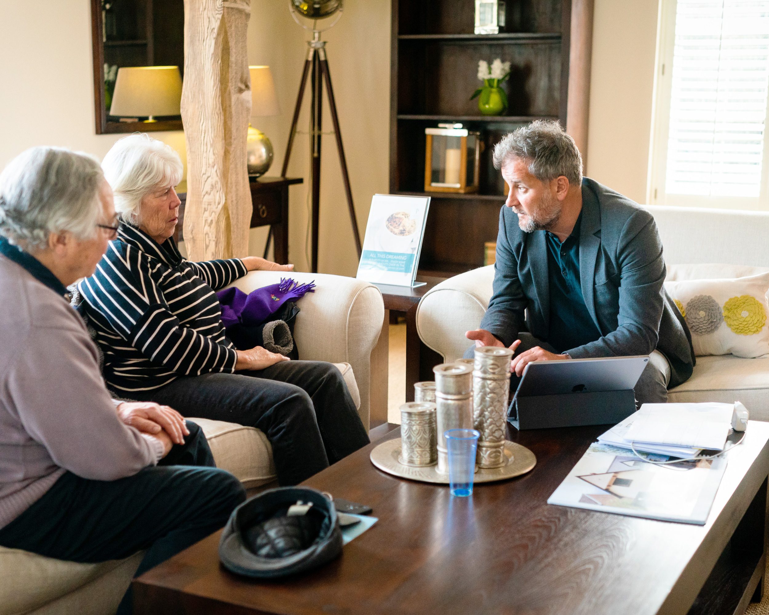 Self-Build planning expert Adrian Bussetil discussing a project with a customer